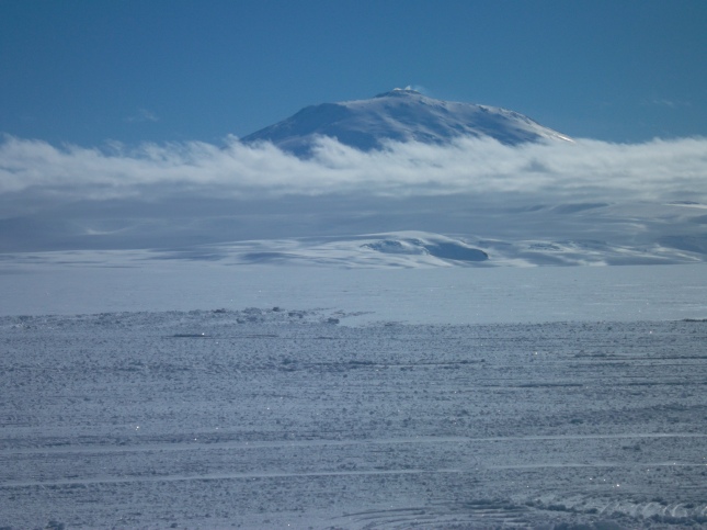 Erebus often has its own clouds. Here, there is a strip of them, so you can see the top and bottom.