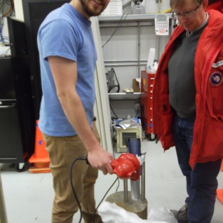 Postdoc Jon comes in and doubles the heat. Barth is dubious, since Jon has neglected to turn on one of the heat guns.